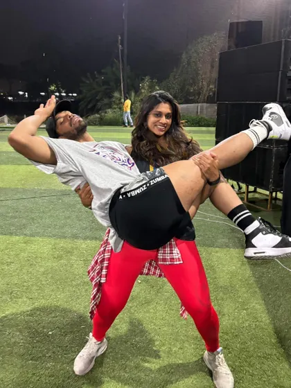 A playful moment captured after the event. The camaraderie and fun are just as important as the workout itself.