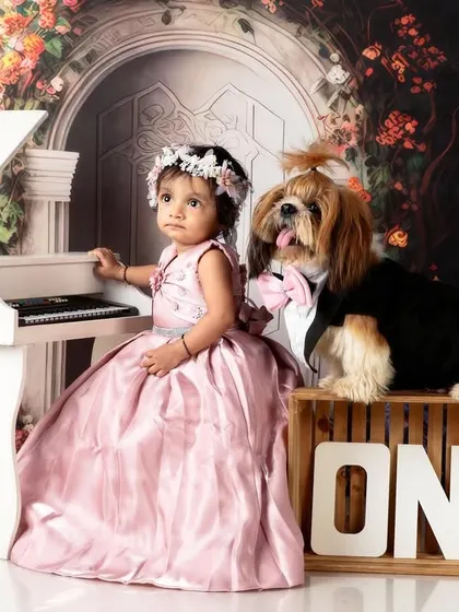 Another adorable shot of the birthday girl and her canine companion. Their bond is truly special and deserved to be captured.