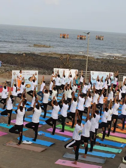 The group practicing Vrikshasana (Tree Pose) together at the Bandra Fort event. It was a powerful moment of shared balance and stability.