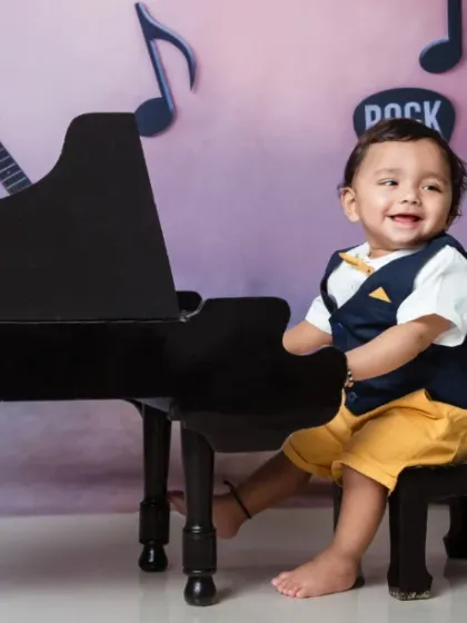 Every note is cuter when played with a giggle. This little musician is a true rockstar.