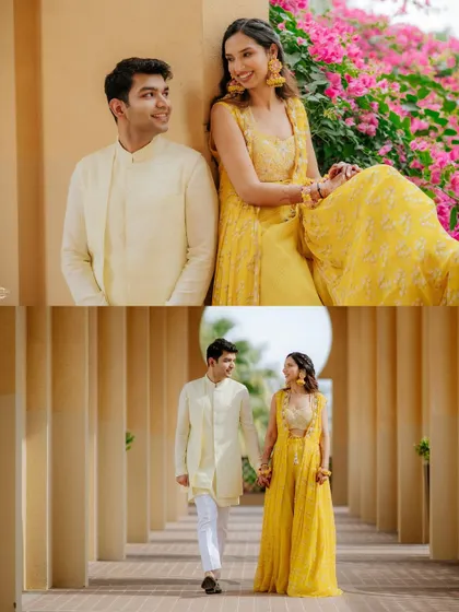 A beautiful couple portrait from a Mehendi event, showcasing their bright outfits against a backdrop of pink bougainvillea and architectural columns.