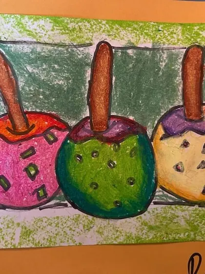 This candy apple drawing was created using oil pastels, showcasing how we introduce students to different art mediums and the unique textures they can create.