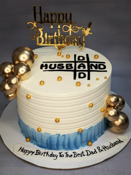 A fun crossword-style cake for the "Best Dad & Husband". This is a fresh pineapple cake with a creative design perfect for a family celebration.