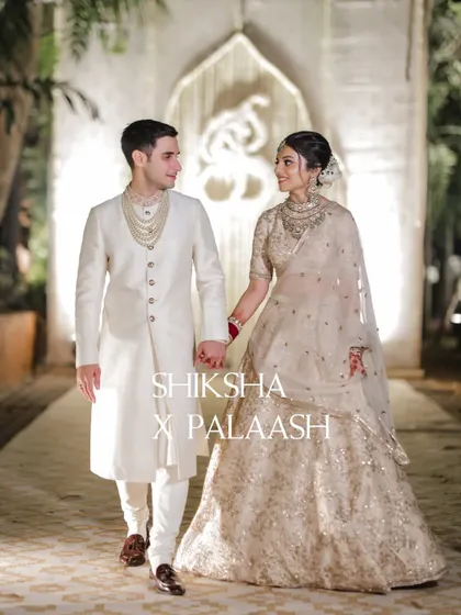 A candid walking shot of the couple after their wedding ceremony at Mayfair Lagoon, Bhubaneswar.