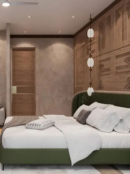 A side view of the bedroom, showing the interplay of the carved wood wall, a comfortable grey sofa, and pendant lighting. The design creates a layered and inviting space with distinct zones for sleeping and lounging.