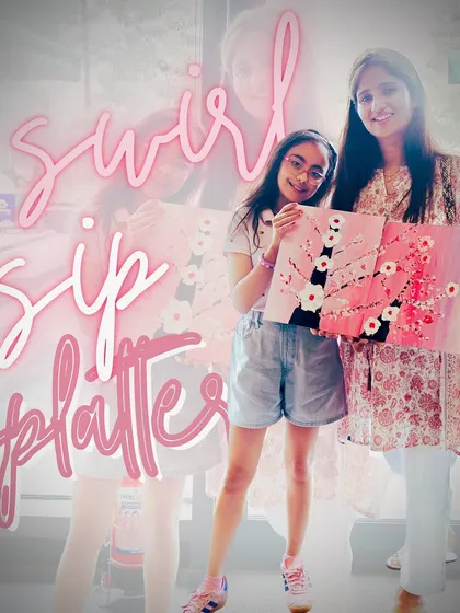 "Swirl, sip, splatter." A mother and daughter duo with their matching cherry blossom artworks. A perfect creative outing.