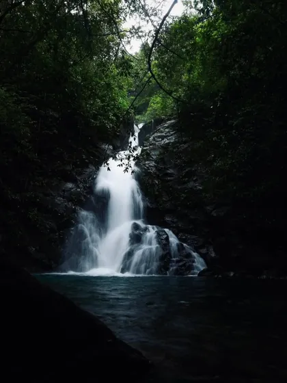 A hidden waterfall in the dense forests of Uttara Kannada, a perfect example of the unexplored beauty we seek out.
