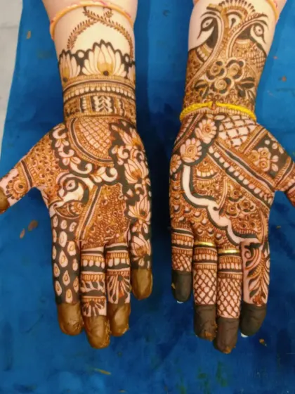 Another angle of the peacock and lotus design. The yellow bracelet adds a nice pop of color against the henna.