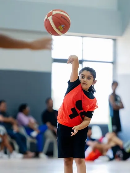 A young player practices her passing, a fundamental skill we emphasize from day one.