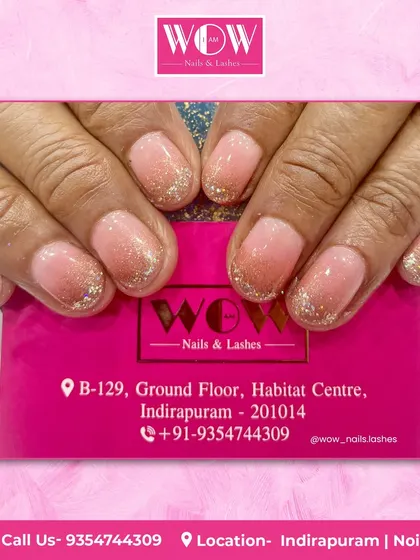 A soft and pretty look featuring a sheer pink base with a delicate silver glitter ombré at the tips. This is a perfect choice for a subtle touch of sparkle.