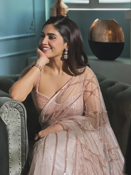 A happy, smiling shot of Bhumi in the pink sequin saree. This look is all about effortless glamour.