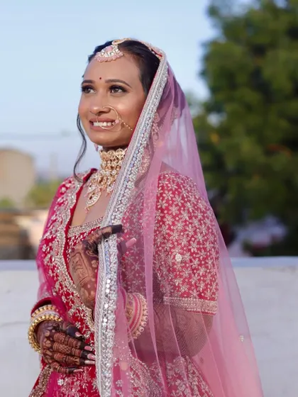 A candid moment of bridal joy. This look was all about soft, glowing skin and defined eyes, designed to look beautiful in natural sunlight and last throughout the day's events.