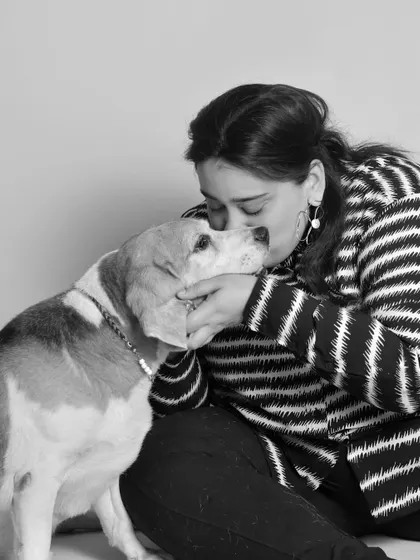 A duplicate of image 73, showing a sweet kiss for a senior beagle. These black and white sessions create emotional and timeless portraits.