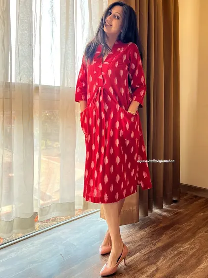 Another look at the elegance of our bestselling red handloom Ikat dress-cum-kurta, a versatile piece for any wardrobe.