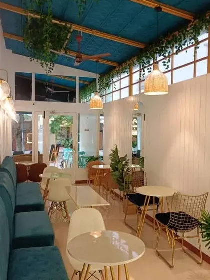 A welcoming entrance is essential for any cafe. Here, we used a mix of seating options near the front, including comfortable banquettes and smaller tables, to create an immediate sense of energy and community.