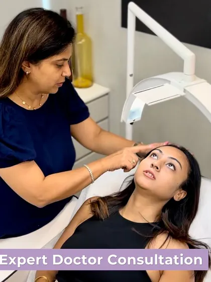 Every great skin journey begins with an expert doctor consultation. Here, I am assessing a client's skin to create a personalized treatment plan, a crucial first step for any bride or groom wanting to achieve flawless skin for their wedding.