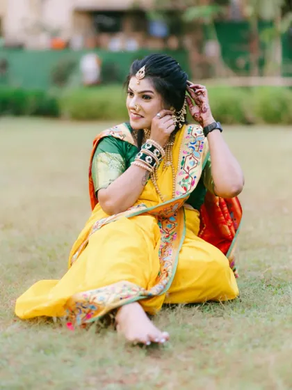 An elegant yellow Nauvari, perfect for a Haldi ceremony or any daytime festive event. The green blouse provides a beautiful contrast.