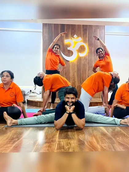 More fun with group yoga formations! These images capture the playful spirit and strong bonds forged in our training programs. It's all about connection and support.
