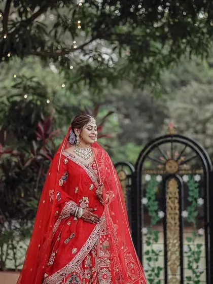 A beautiful candid moment. The makeup is designed to be durable and photogenic, ensuring the bride looks flawless throughout the day, from the formal portraits to the candid laughs.