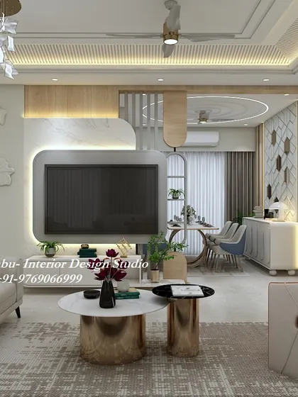 An open-concept living and dining area where a 3D floral wall sculpture and a modern TV unit command attention. The gold accents on the tables and furniture add a cohesive, luxurious feel.