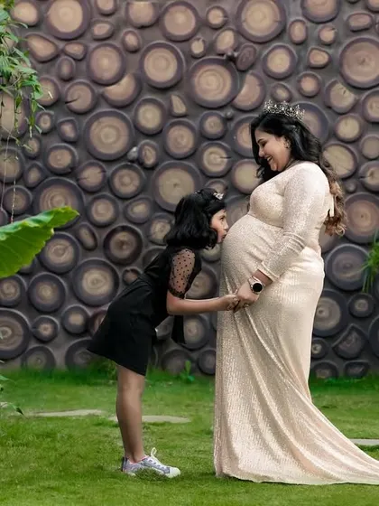 This is a duplicate of image 7. We love capturing the sweet connection between a mother-to-be and her older child, preserving the excitement of a growing family.