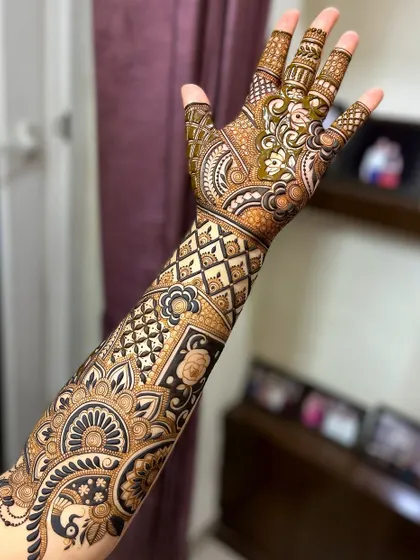 This bridal design features a mix of modern geometric patterns and traditional floral work, showing my versatility.