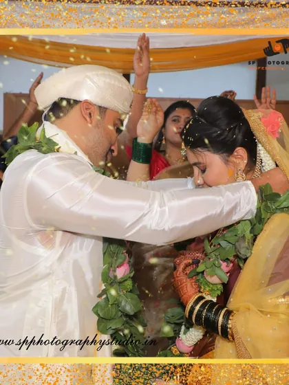 A key moment from the wedding ceremony, captured with a creative frame. We focus on the ritual while also highlighting the couple's connection.
