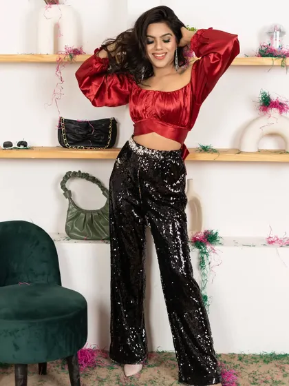 A fun and festive shot for a party wear collection. The decorated studio set creates a celebratory mood perfect for the brand's campaign.