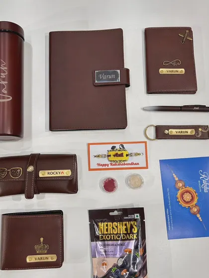 A closer look at my personalized men's accessory set, perfect for Rakhi. This one in tan includes a wallet, diary, passport cover, pen, keychain, and eyewear case, all with custom name engraving.