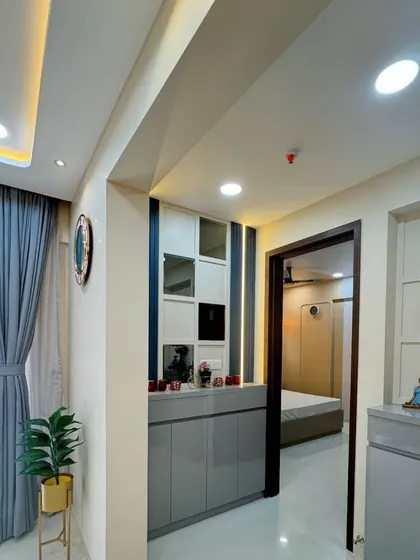 Another view of the entryway, showing the grey storage unit in the context of the hallway. The design is modern and helps create a welcoming first impression.