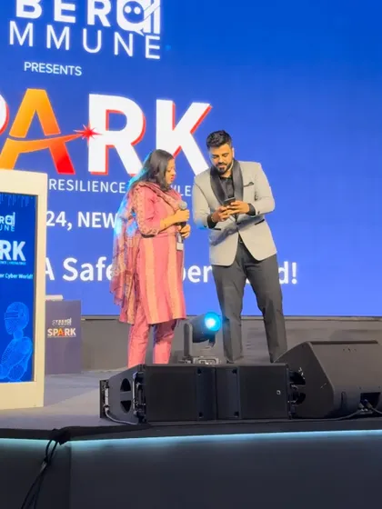 On stage at the Cyber AI Commune, performing a mind-reading effect with a volunteer.