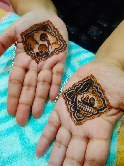 A minimalist take on the Karva Chauth theme, with small, detailed figures of a couple within traditional frames on the palms.