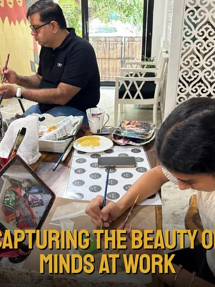 This image captures the beauty of minds at work. Students of all ages are engrossed in their projects, learning and creating in a supportive environment.