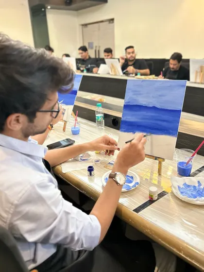 Another participant working on his interpretation of the beach scene.
