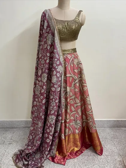 A beautiful lehenga set featuring a floral printed skirt in shades of pink and a contrasting purple dupatta. I paired it with a simple gold sequin blouse.