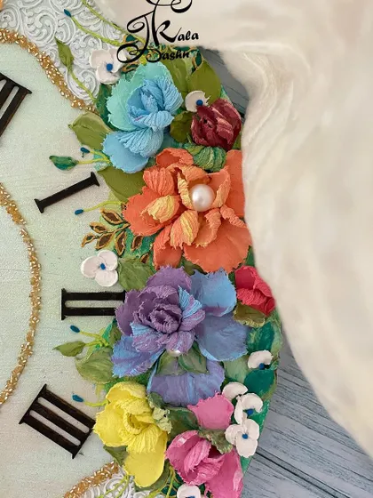 A close-up of another 14-inch clock, showing the arrangement of flowers around the Roman numerals. I use pearls and other small details to add extra dimension and a touch of sparkle.