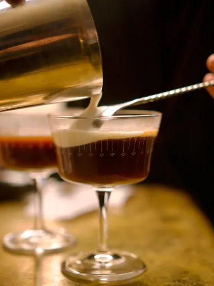 Pouring a creamy, festive cocktail. Our Christmas bar menu featured special drinks like this to complement the holiday food.