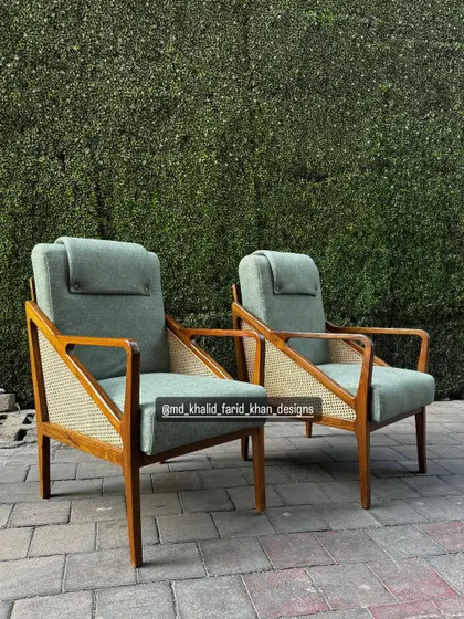 A straight-on view of the elegant and comfortable high-back lounge chairs.