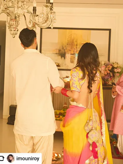 A beautiful abstract landscape provides a serene and sophisticated backdrop during a family ceremony, enhancing the warmth of the moment.