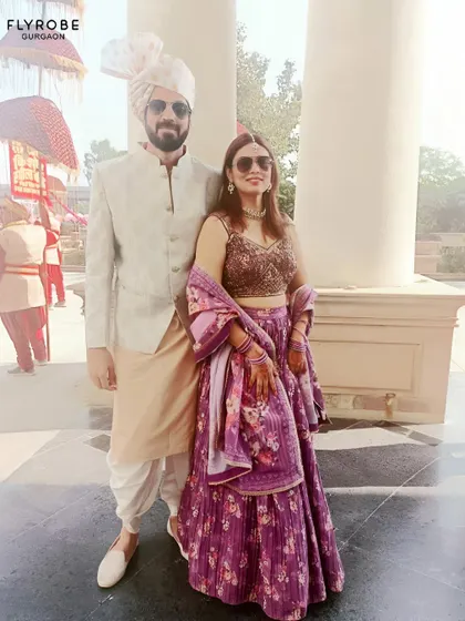 Another shot of this stylish couple, ready for a day wedding. Their coordinated outfits are a perfect example of modern ethnic fashion.