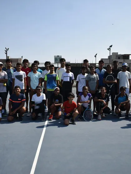 A group photo from a past college camp. These events help build a community of players who are all aiming for the same goal: playing tennis at the collegiate level in the US.