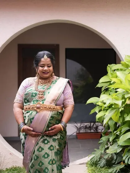 A beautiful shot capturing the mother-to-be's glow. Our sarees are chosen to enhance this special radiance.