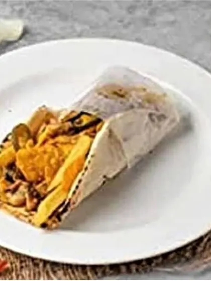A clean, plated view of the Mexican fusion shawarma, showcasing the generous filling of chicken, fries, and jalapeños.