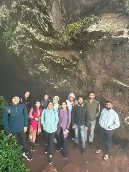 Our group exploring a cave-like formation during the Chikmagalur trip.