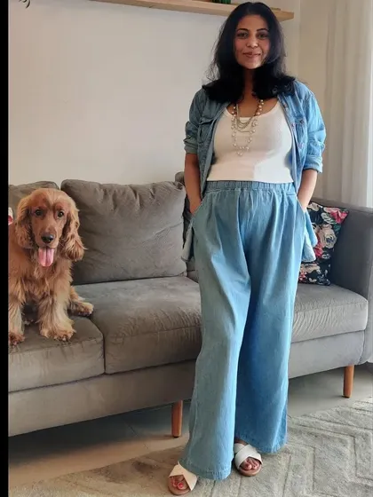 A stylish and comfortable maternity outfit doesn't have to be complicated. This look combines a simple tank, an open denim shirt, and wide-leg denim pants for ultimate ease.