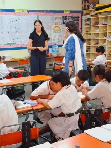 In a classroom at a DPS school, observing students as they work on a math problem. My role as a consultant often involves watching lessons to provide feedback and suggest new strategies.