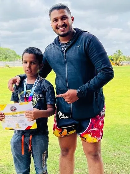 This young fighter earned his medal and certificate through focus and hard work. I am proud to be his coach.