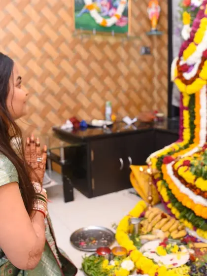 A moment of prayer and devotion, capturing the spiritual side of the family ceremony.