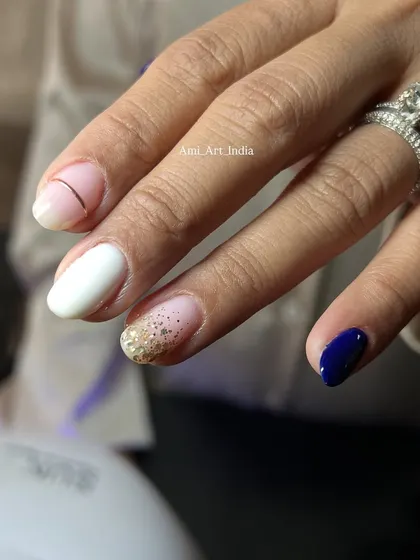 An abstract design combining a glitter ombré, solid colors, and a simple line detail.
