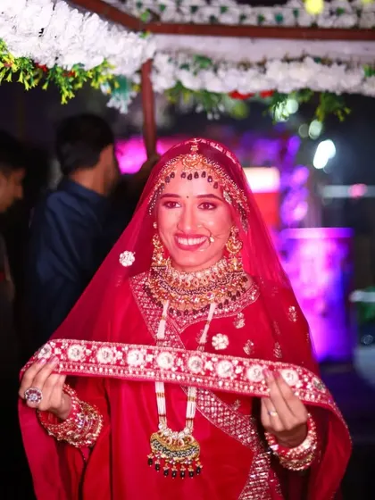 A candid shot of the bride during her wedding ceremony, her face lit up with joy. The makeup is designed to be waterproof and transfer-proof for such emotional moments.